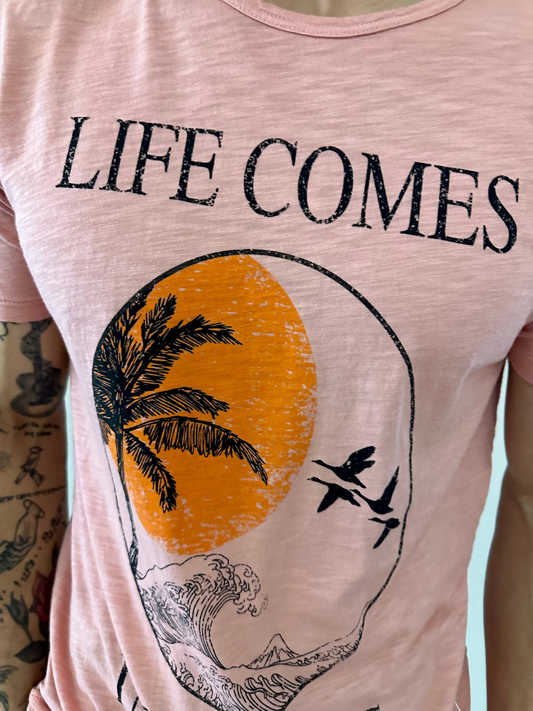"LIFE COMES IN WAVES" on our 4 Corners Crew neck (Salmon)